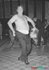 Photo of Buddy Hackett without his shirt dancing at a Frank Sinatra party