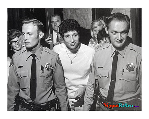 Photo of Tom Jones with fans and cops backstage in Las Vegas circa 1967
