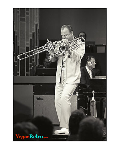Photo of Bob Mitchell playing two trumpets on the Sammy Davis Jr show