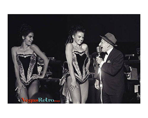 Photo of Jimmy Durante and showgirls on the Las Vegas stage