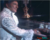 Liberace at the piano