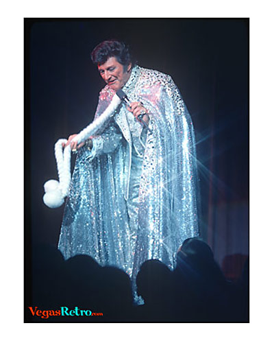 Liberace communes with his audience on Vegas stage