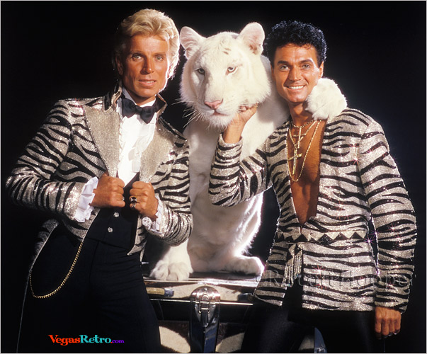 Photo of Siegfried & Roy with white tiger