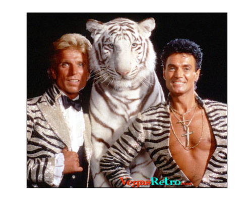 Photo of Siegfried & Roy with white tiger