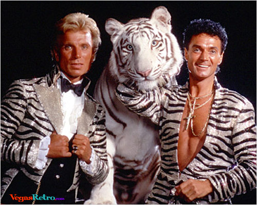 Photo of Siegfried & Roy with white tiger