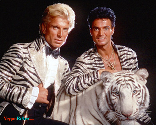 Image of Siegfried & Roy with white tiger