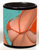 Photo of bare breasts on a black coffee mug