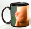 Photo of bare breasts on a black coffee mug