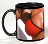 Photo of breasts in a red swimsuit reproduced on a black coffee mu