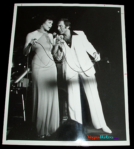 Photo of Paul Anka & Odia Coates on a Las Vegas stage