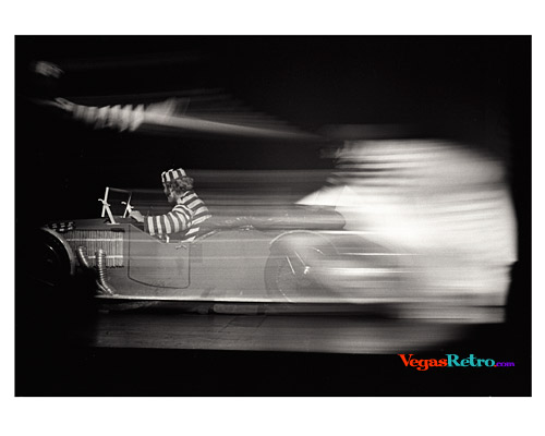 Image of a speeding car on stage in the Casino de Paris show
