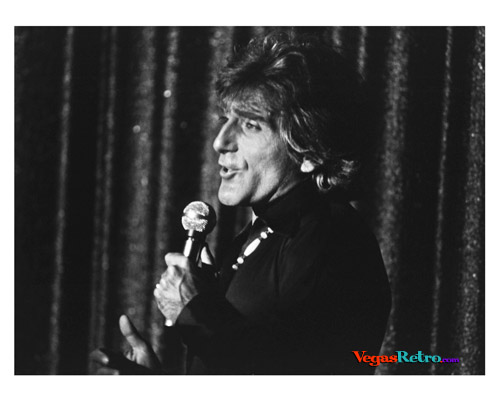 Photo of male singer on stage in "Vive Paris Vive" Show in Las 1975 Vegas