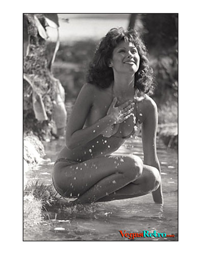 MARIA'S NO MYTH - Stories of water nymphs date back to Greek mythology, but Las Vegas has its own breed of nymphs like Los Angeles singer-dancer-model Maria Elena, shown here taking a refreshing splash in an attempt to gain relief from our record-breaking heat wave) compared to the Middle-West, that is.)