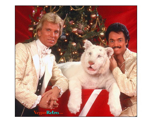 Photo of Siegfried & Roy with baby white tiger at Christmas