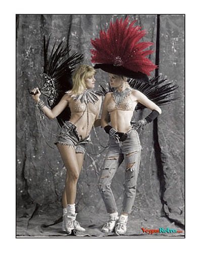 photo of two "Folies Bergere" showgirls in costume with tennis shoes