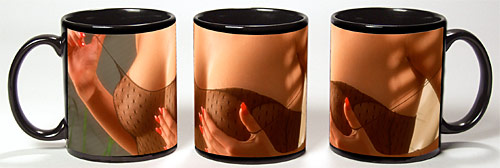 Photo of nearly bare breasts on a black coffee mug