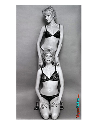 DOUBLE HALLOWEEN HOLIDAY TREAT - It's not trick photography or witchcraft.  These are the Holiday twins, Leigh and Lyn.  Lyn is the older, they say, but we don't know witch is witch.  They are Playboy models from Wisconsin and would like to spend more time in Las Vegas.  They say they have twice as much fun here.